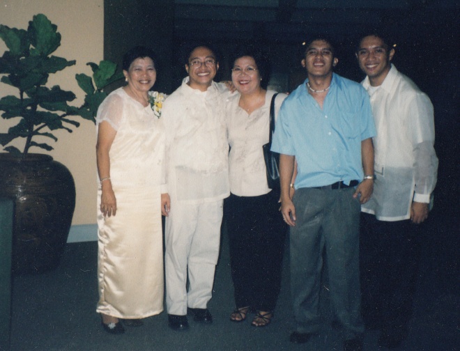 Left to right: My mom, I, Ms. May Flores of XUHS, and my two brothers, Jesse and Jayson.